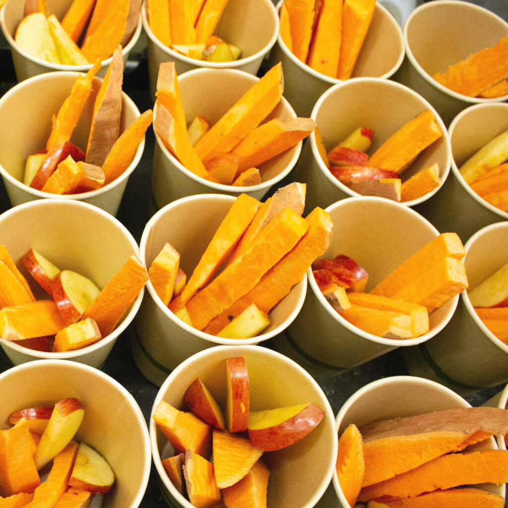feed cups filled with carrots and apples